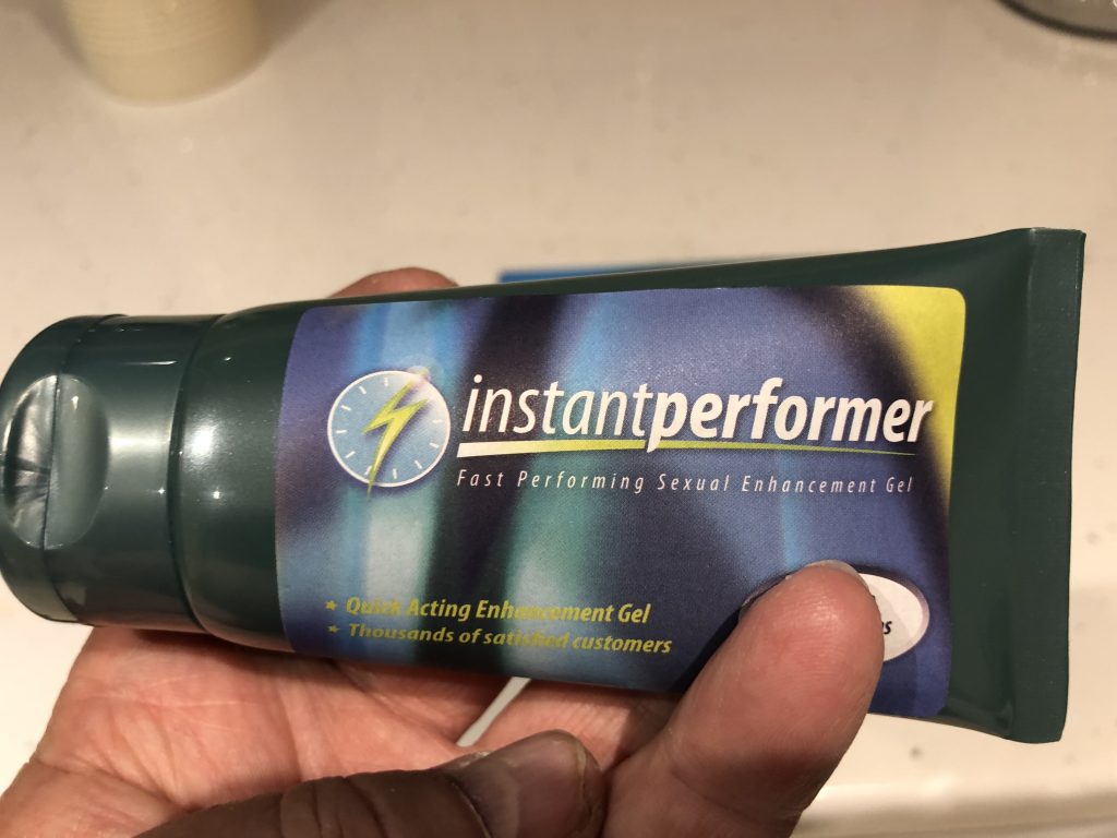 holding a bottle of instant performer